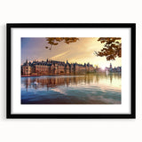 Abstract art print of a colorful European scenery in vibrant hues on a textured, extra large canvas, framed in black.