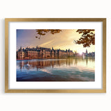 Abstract art print of a European landscape in muted earth tones, framed with a gold mat, suitable for dining room decor.