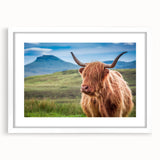 Textured art depicting a rolling Scottish landscape in muted greens and blues on a framed white mat, ideal for bedroom decor.