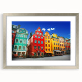 Textured art print of abstract Stockholm scenery in muted gray and blue tones, framed with a silver mat.