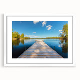 Abstract art print of a serene Swedish landscape in muted green and blue tones on a framed white mat.