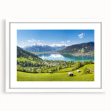 Abstract art print of a Swiss landscape in muted blue and green tones, framed with a white mat.