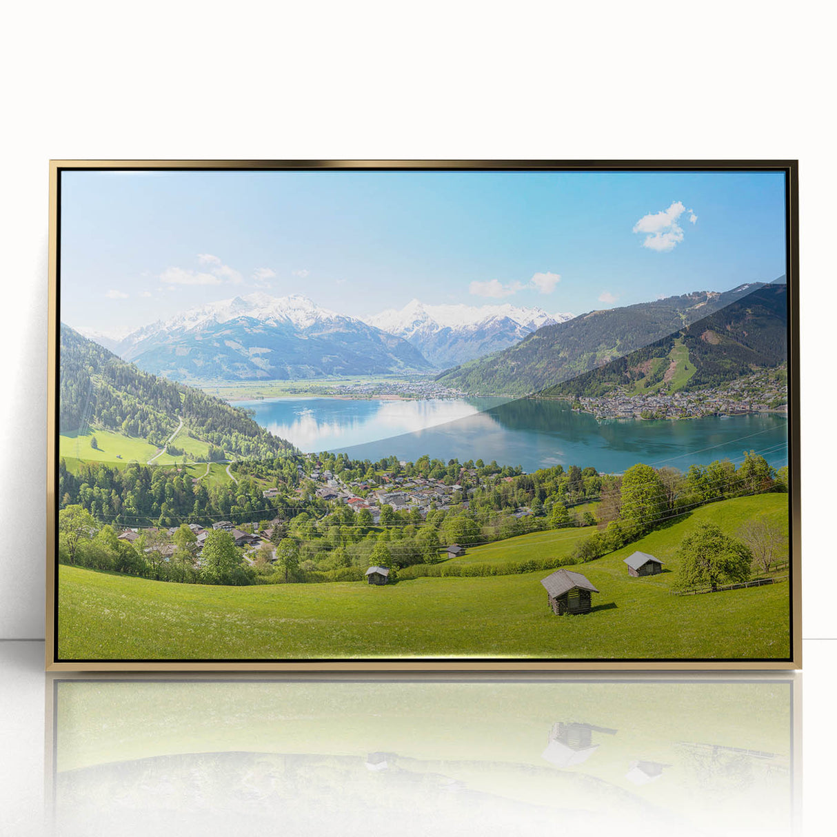 Acrylic print of a Swiss landscape scene in muted earth tones, framed in gold, ideal for modern nursery wall art.