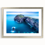 Textured art print depicting abstract Welsh scenery in muted earth tones, framed with a silver mat.