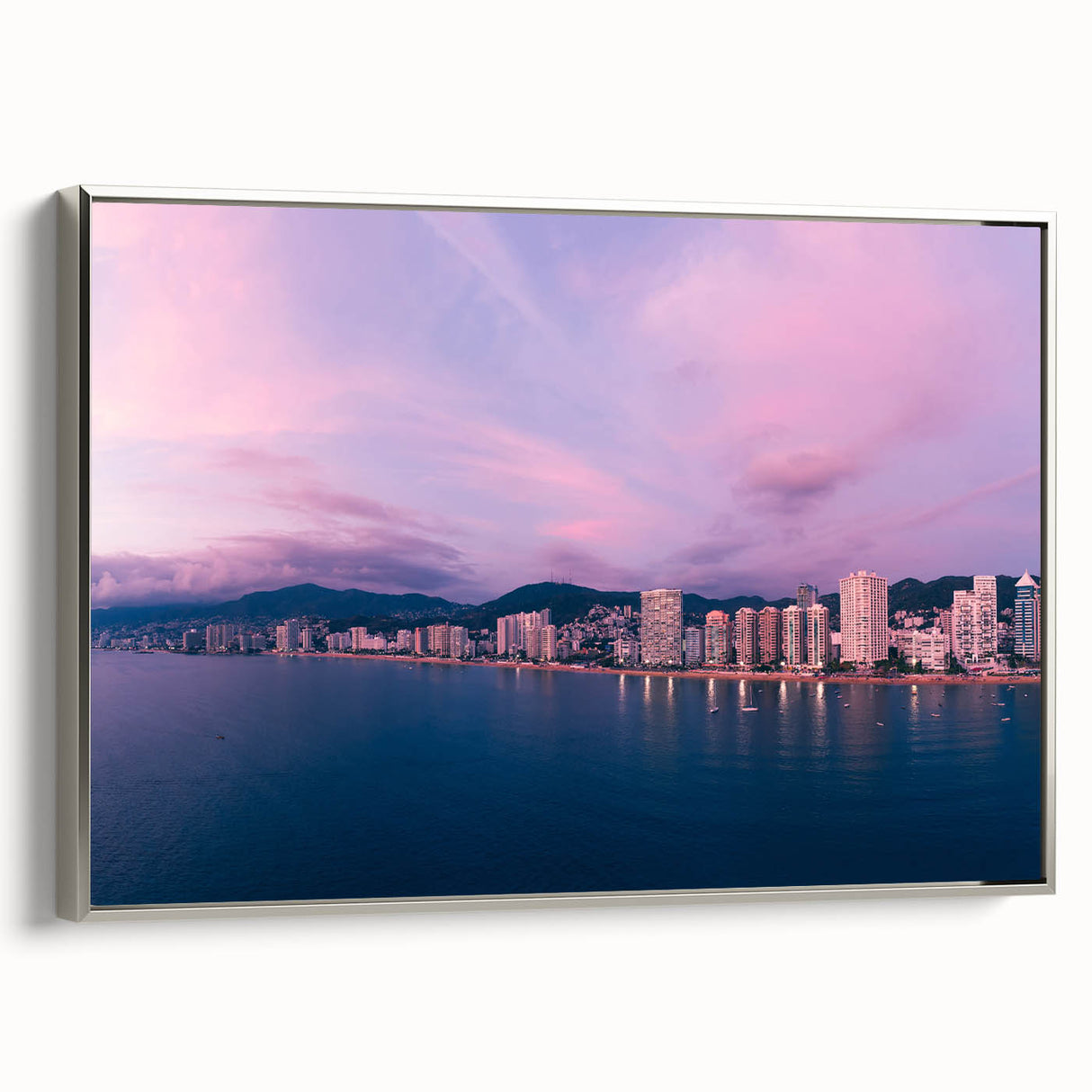 Framed canvas of a vintage Acapulco landscape with colorful foreground and black sky, ideal for living room decor.