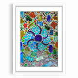 Abstract art print of Cabo San Lucas with vibrant blue and green tones on a framed white mat, ideal for dining room decor.