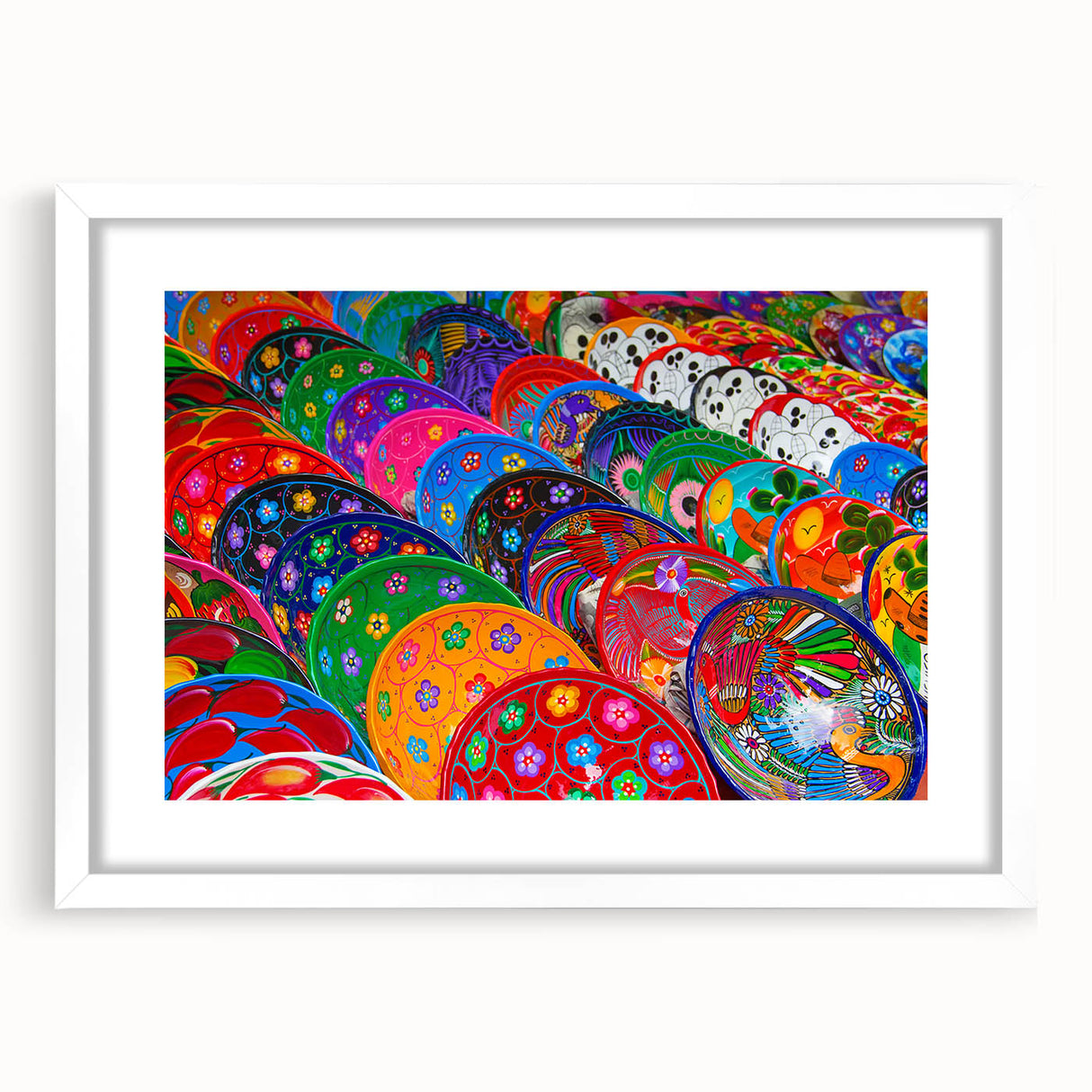 Abstract art print of Cancun scenery in muted blue and green shades on a framed white mat, ideal for dining room decor.