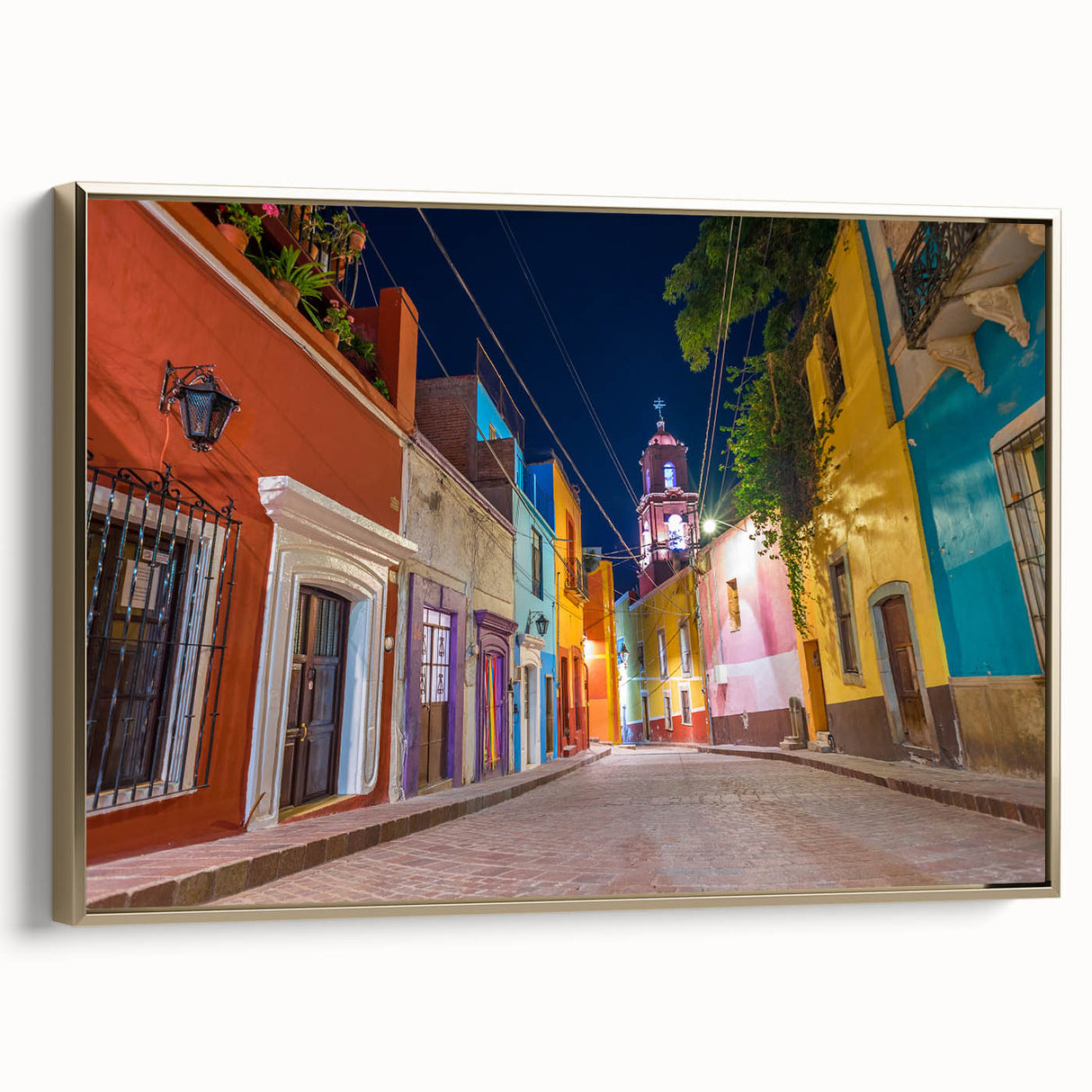 Framed canvas of Guanajuato, Mexico landscape with vintage poster art style in black and gold, ideal for bedroom wall art.