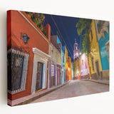 Large stretched canvas featuring a vibrant street scene of Guanajuato, Mexico in vivid colors, ideal for kitchen wall art.