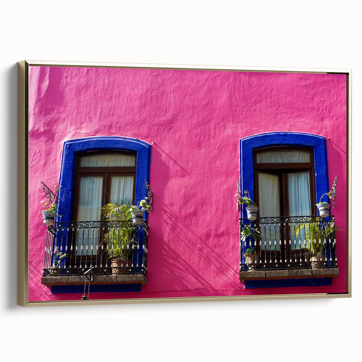 Framed canvas of a vintage-style Oaxaca landscape in gold and black tones, ideal for bedroom wall art.