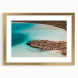 Textured abstract art print depicting a serene Quintana Roo scenery in muted earth tones, framed in gold.