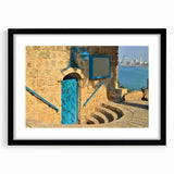 Extra large abstract art print of Tel Aviv skyline in vibrant colors on a textured canvas, framed in black.