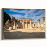 Framed canvas featuring a vintage-style landscape painting of a Middle Eastern scenery in gold and black tones.