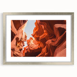 Textured art print of an abstract Jordanian landscape in earth tones, framed in silver, ideal for bedroom decor.