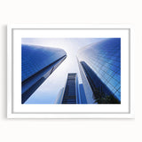 Abstract art print of Abu Dhabi skyline in muted blue and white tones on a framed poster.