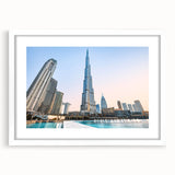 Abstract art print of Burj Khalifa in muted gray and blue tones on a framed white matte canvas.