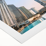 Extra large wall art featuring line art flowers and the Burj Khalifa in muted tones on a rolled canvas.