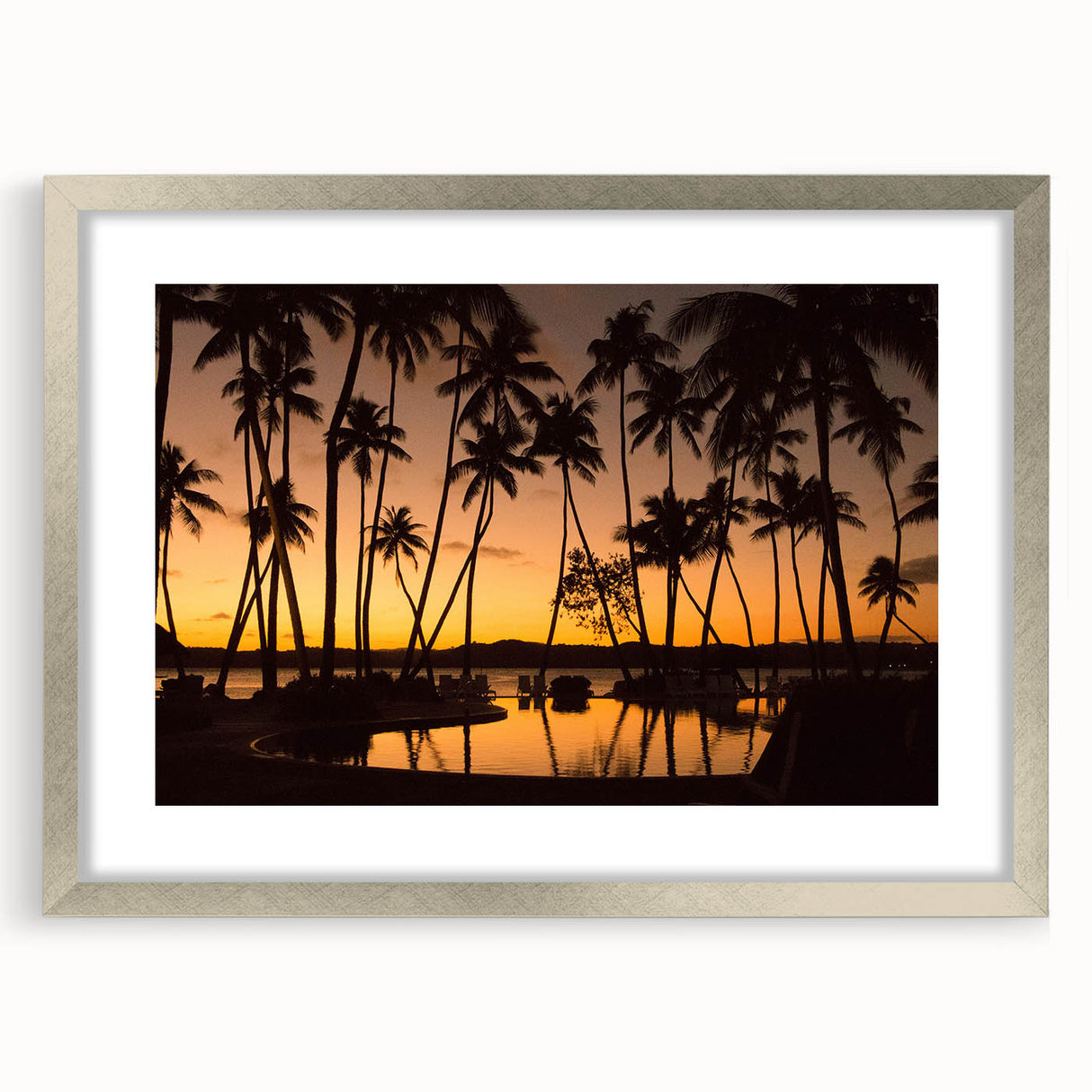 Textured abstract art print depicting an oceanic scene in blue and green tones, framed in silver.