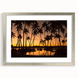 Textured abstract art print depicting an oceanic scene in blue and green tones, framed in silver.