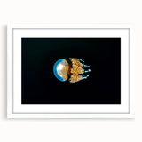 Abstract art print featuring soft blue and green hues on a white framed canvas, ideal for dining room decor.