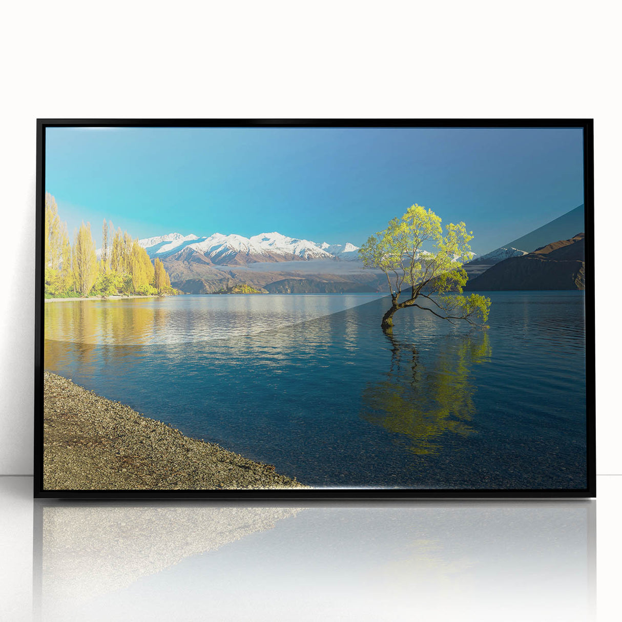 Large abstract wall art depicting Otago, New Zealand scenery in vibrant blues and greens, framed in black acrylic.