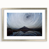 Textured art depicting abstract Mount Taranaki in New Zealand with muted earth tones on a silver-framed canvas.