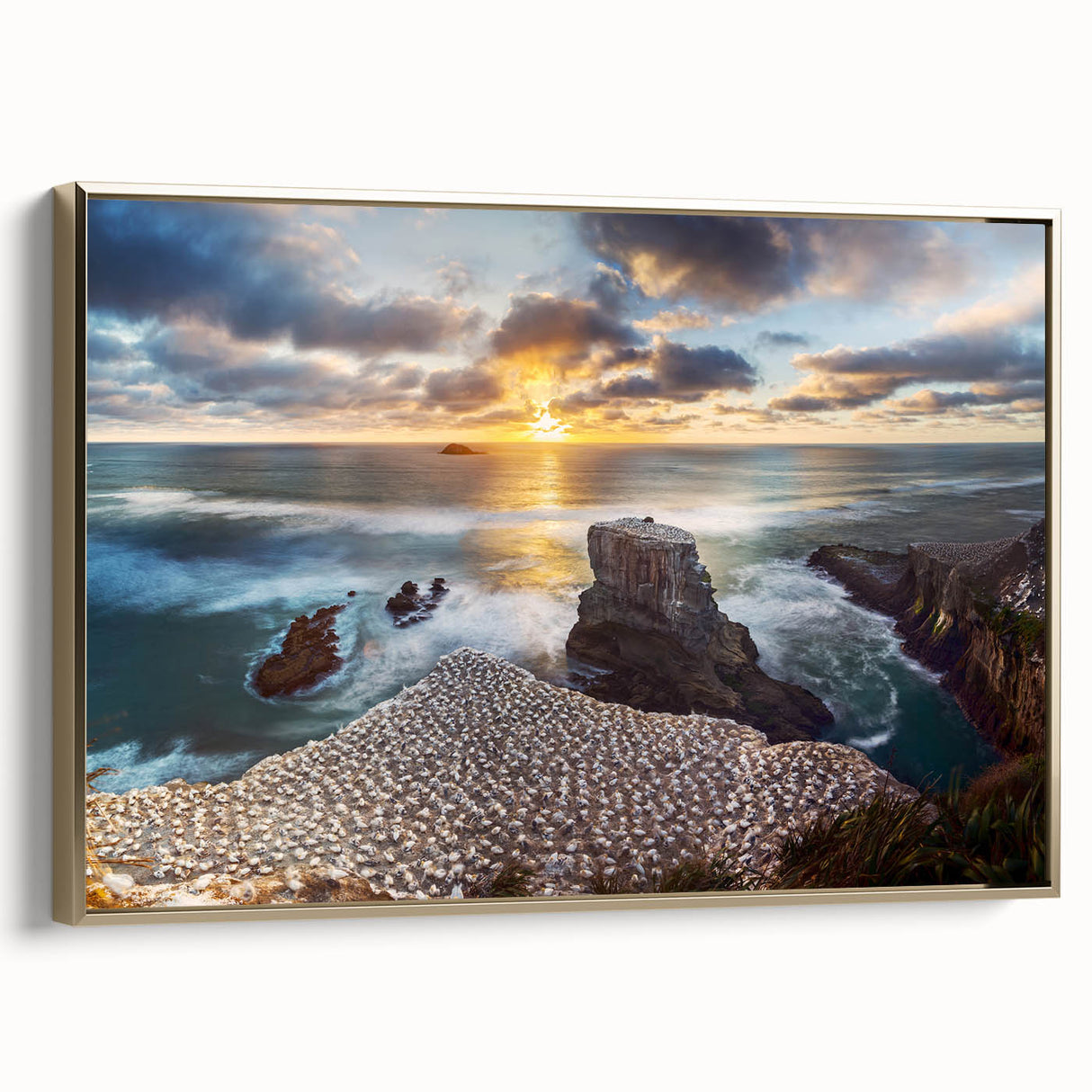 Framed canvas featuring a vintage-style landscape painting of New Zealand's west coast in black and gold tones.