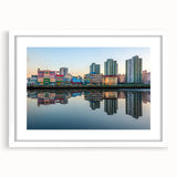 Abstract art print of Buenos Aires skyline in muted blue and grey tones on a white framed canvas.