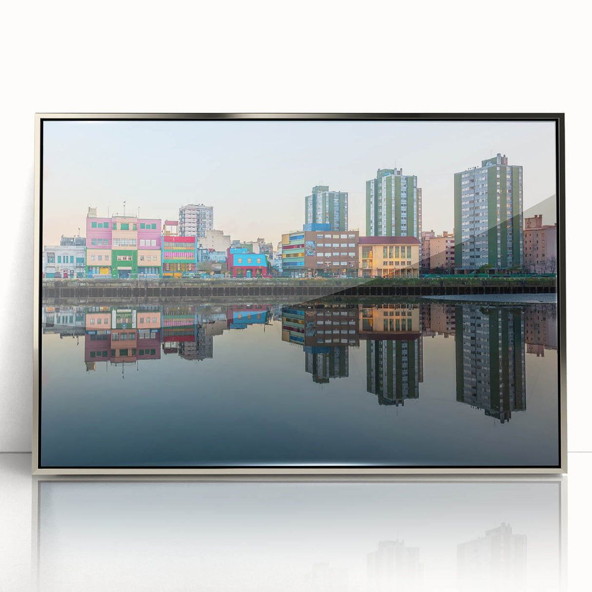 Mid-century modernist art depicting a cityscape in muted silver and blue tones on a framed acrylic.