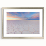 Textured abstract art print of a Bolivian landscape in muted earth tones, framed in silver, suitable for bedroom decor.
