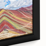 Close-up of a framed canvas featuring a textured, colorful depiction of a South American scenery.
