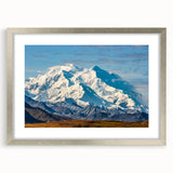 Textured art print of Denali, Alaska in abstract style with muted earth tones on a framed silver mat, ideal for bedroom art.