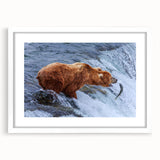 Abstract art print of Alaska scenery in muted blue and white tones on a framed poster.