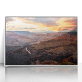 Acrylic print of the Grand Canyon in muted earth tones, framed in white, suitable as modern art wall decor for a living room.