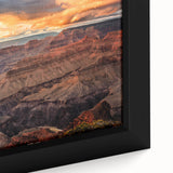 Framed canvas of the Grand Canyon in textured black with vibrant color accents, ideal for living room decor.