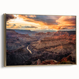 Framed canvas wall art featuring a vintage poster-style depiction of the Grand Canyon in black and gold tones.