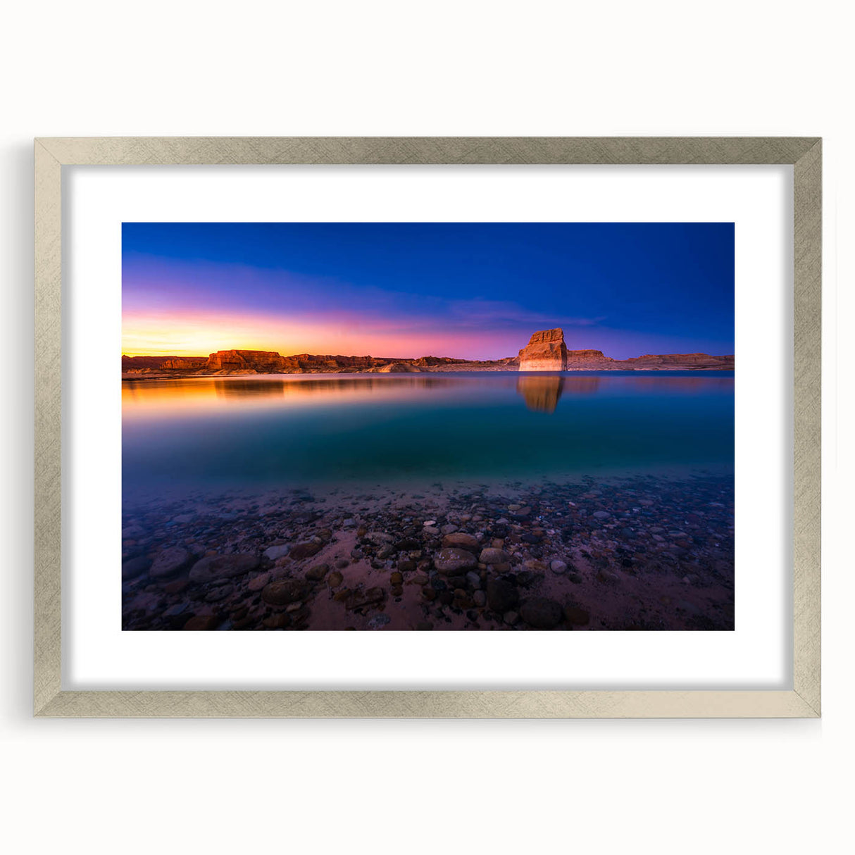 Textured abstract art print of Lake Powell in muted earth tones on a framed silver mat, suitable for bedroom art.