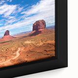 Extra large framed canvas of Monument Valley with textured black foreground and colorful sky, suitable for living room decor.