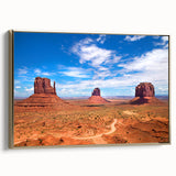 Framed canvas depicting Monument Valley in muted earth tones, ideal for bedroom wall art.
