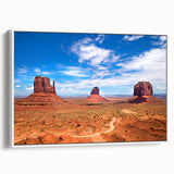 Vintage poster art of Monument Valley on a framed canvas, featuring a colorful palette, ideal for living room decor.