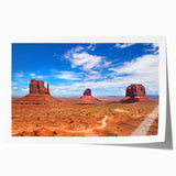 Monument Valley landscape on rolled print, featuring earthy red and orange tones, suited for dining room wall art.
