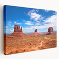 Monument Valley landscape on large stretched canvas, featuring earthy red and orange tones, suitable for kitchen wall art.