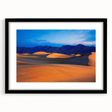 Abstract art print of Death Valley in vibrant, textured colors on a large framed canvas, ideal for living room decor.