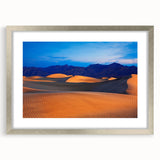 Textured art of Death Valley in abstract style, muted earth tones, framed with a silver mat, ideal for bedroom art.