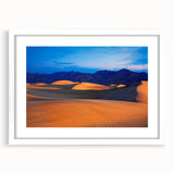 Abstract art print of Death Valley in muted earth tones on a framed white mat, suitable for bedroom or dining room decor.
