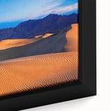 Extra large framed canvas of a textured black wall art depicting Death Valley under a colorful sky.