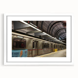 Abstract art print of the Hollywood skyline in muted gray and blue tones on a framed white canvas.