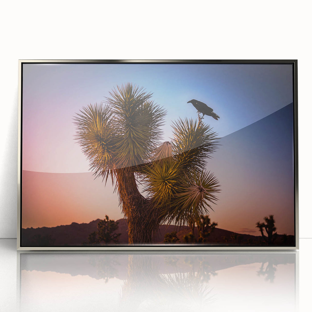 Mid-century modernist art featuring Joshua Tree landscape in muted earth tones on a silver-framed acrylic print.