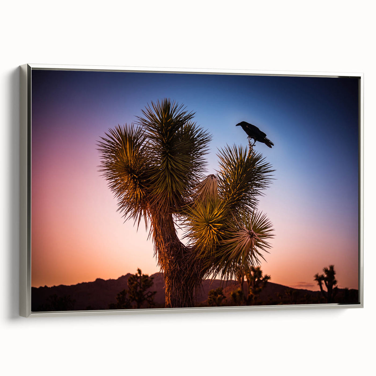 Framed canvas of a Joshua Tree landscape in muted earth tones, ideal for adding a vintage touch to living room decor.