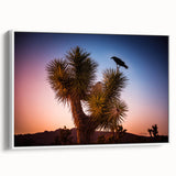 Vintage poster art of Joshua Tree on a framed canvas, featuring muted earth tones, ideal for living room decor.